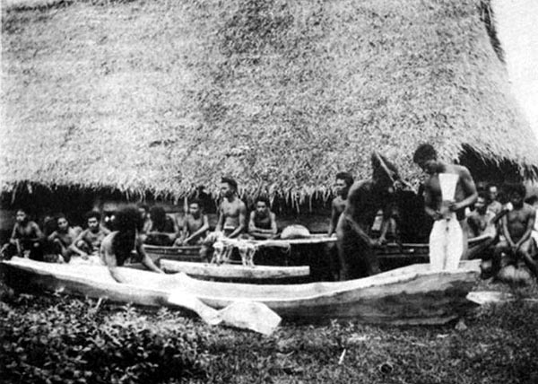 Carving a canoe